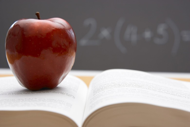 Photo of apple on a book